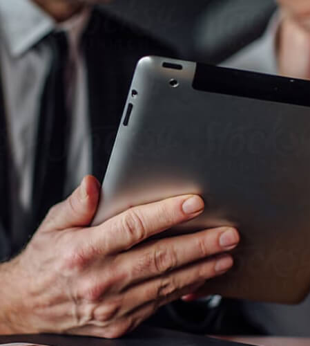 Hand holding a tablet device