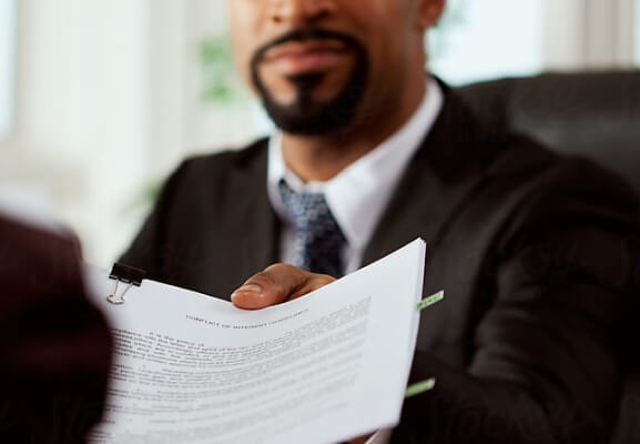 Man handing off papers