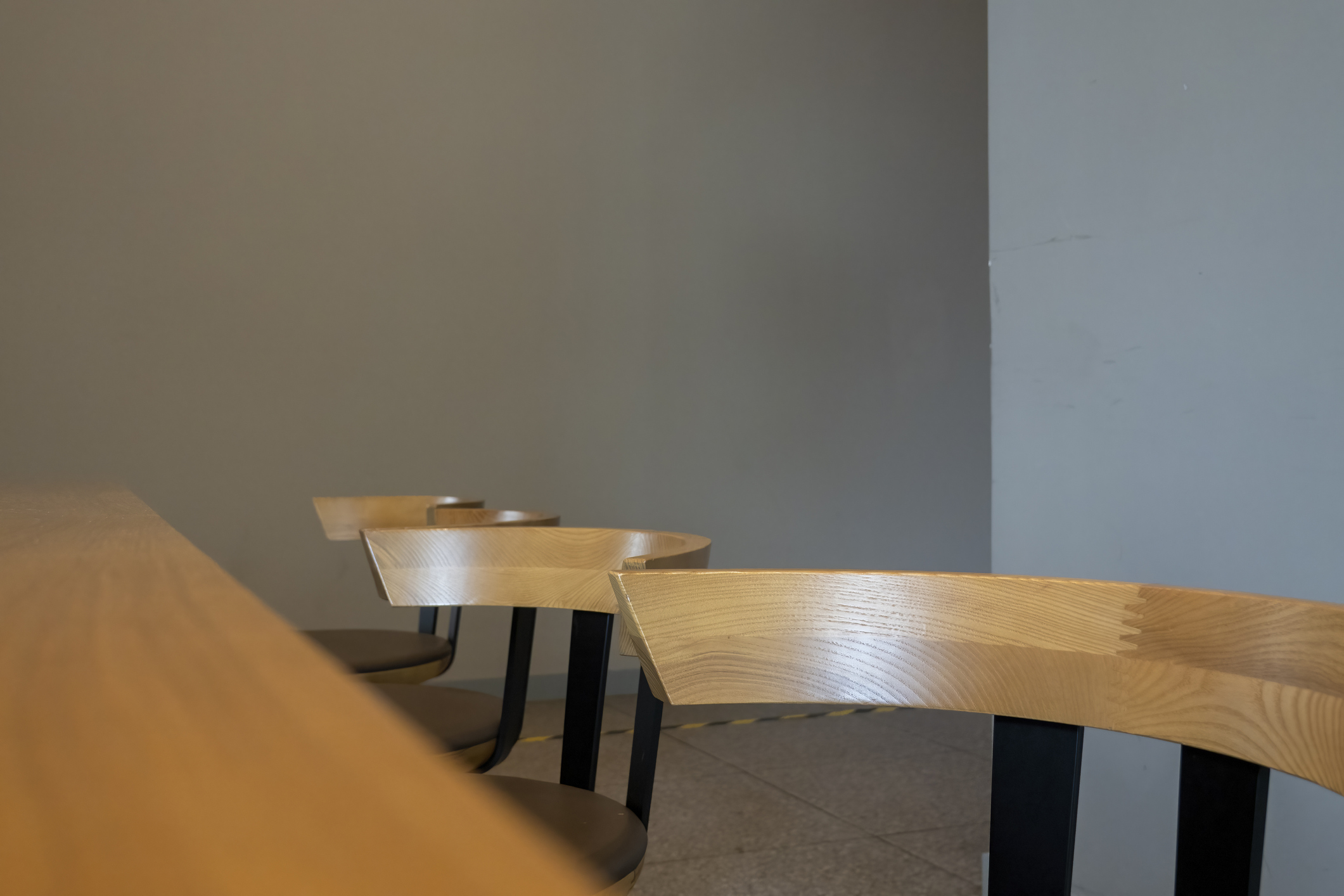 A row of chairs at the table