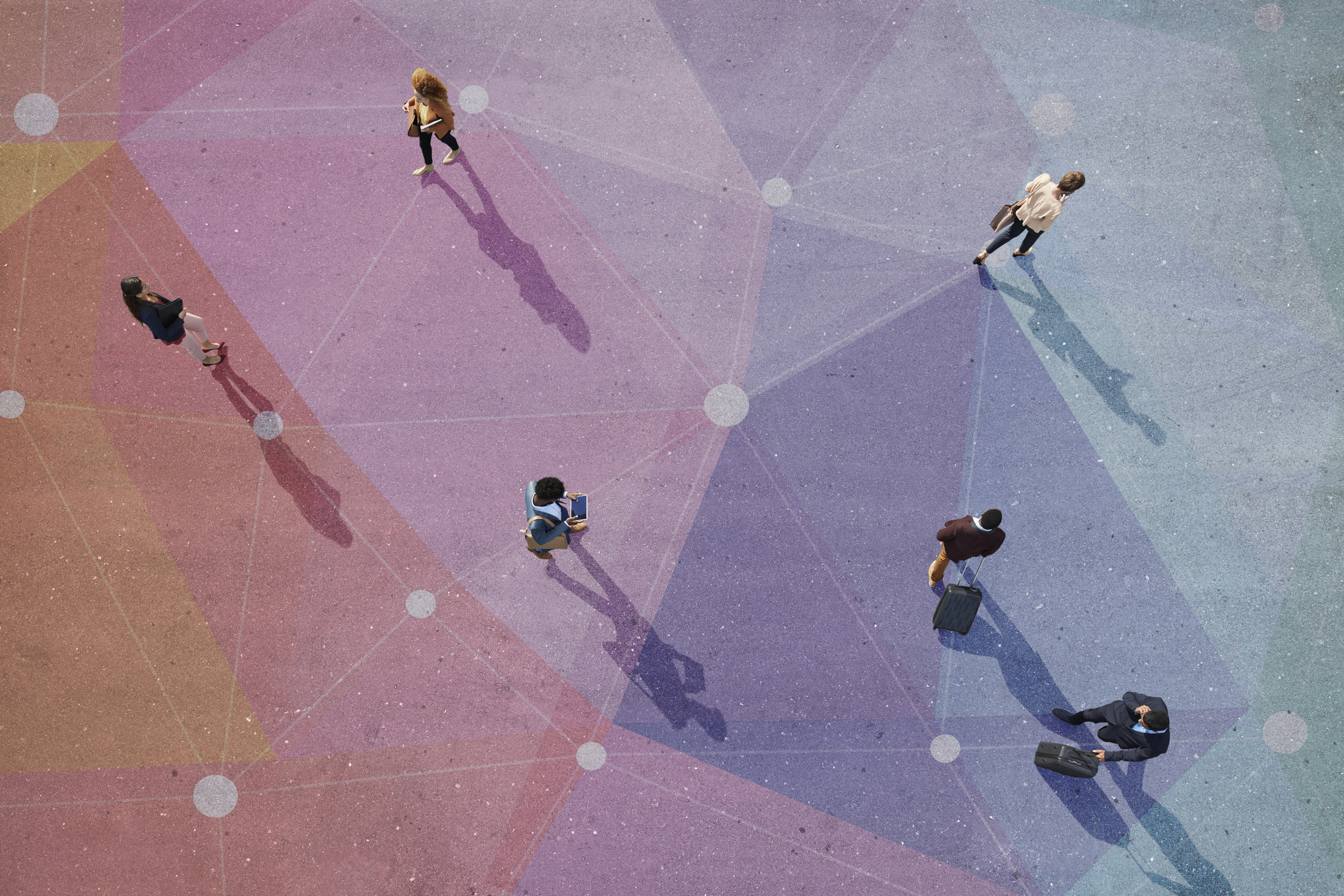 Group of young adults, photographed from above, on various painted tarmac surface, at sunrise.